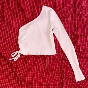 Cropped one sleeve top.